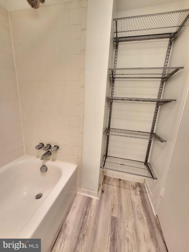 3100 S Manchester St Unit 909, Falls Church, VA 22044 - full bathroom featuring a tub, wood finished floors, walk in shower, and baseboards