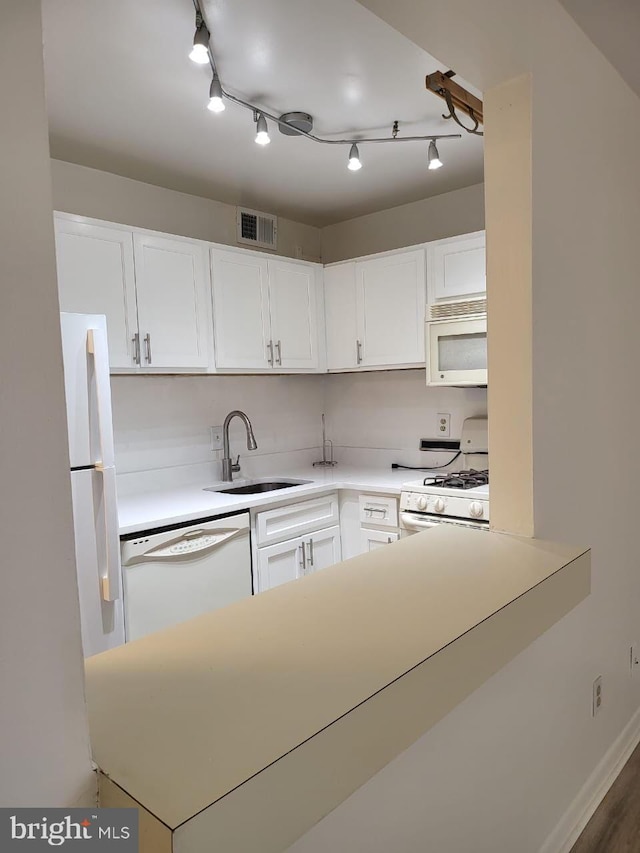 3100 S Manchester St Unit 909, Falls Church, VA 22044 - kitchen featuring white appliances, light countertops, a sink, white cabinetry, and visible vents