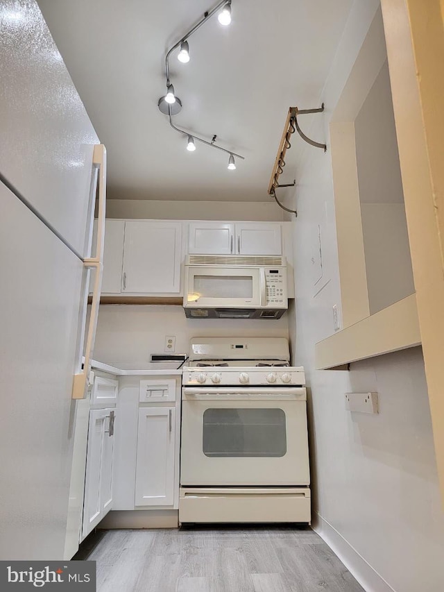 3100 S Manchester St Unit 909, Falls Church, VA 22044 - kitchen with white cabinetry, white appliances, light countertops, and baseboards