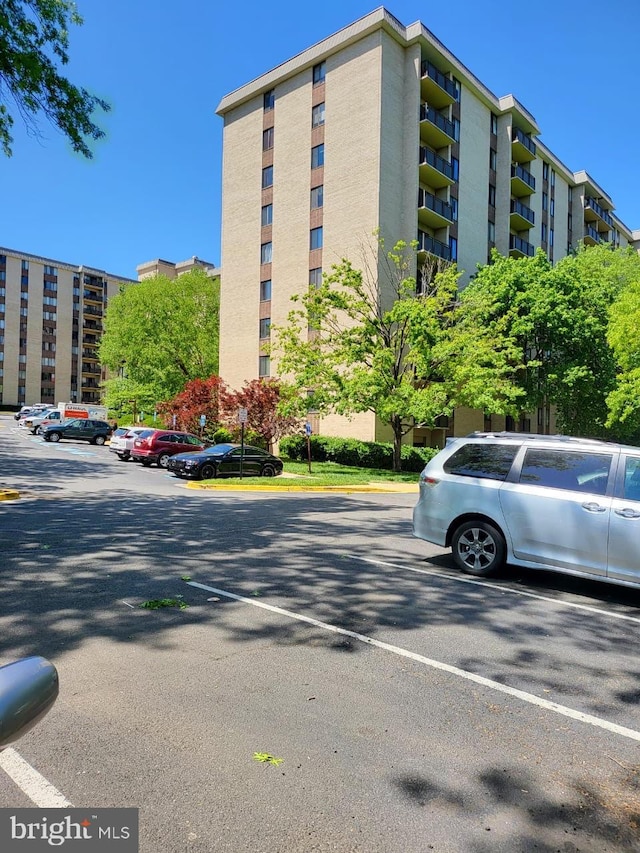 3100 S Manchester St Unit 909, Falls Church, VA 22044 - view of building exterior featuring uncovered parking