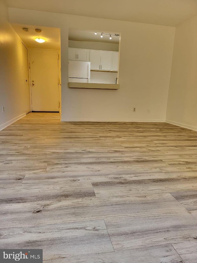 3100 S Manchester St Unit 909, Falls Church, VA 22044 - spare room with light wood-type flooring and baseboards