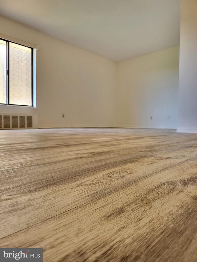 3100 S Manchester St Unit 909, Falls Church, VA 22044 - spare room with wood finished floors, visible vents, and baseboards