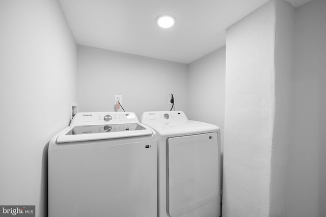 washroom featuring laundry area and independent washer and dryer