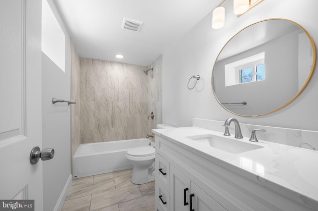 bathroom featuring shower / tub combination, visible vents, toilet, and vanity