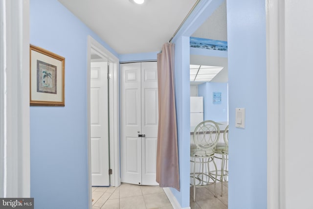 hallway featuring tile patterned floors