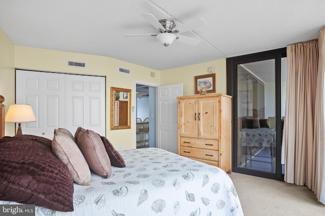 bedroom with access to outside, visible vents, a closet, and light carpet