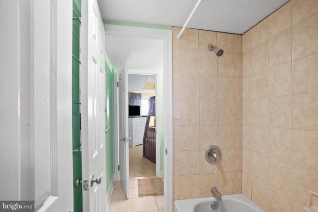 bathroom with tile patterned flooring and bathing tub / shower combination