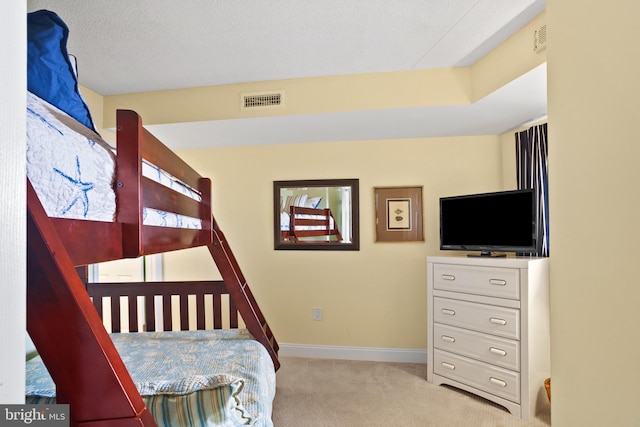 bedroom featuring carpet flooring, baseboards, and visible vents