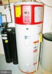 utility room featuring water heater