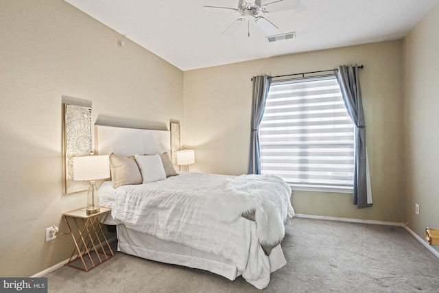 carpeted bedroom featuring visible vents, ceiling fan, and baseboards