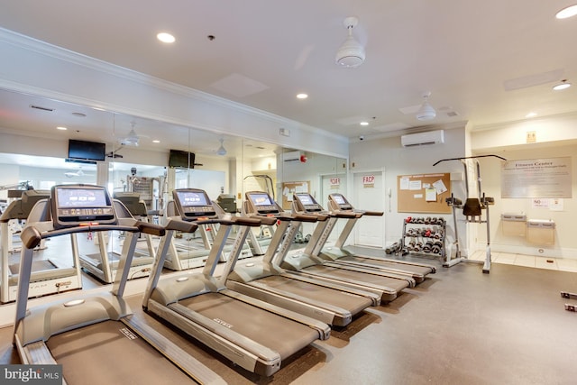 workout area featuring a wall unit AC, recessed lighting, and ornamental molding