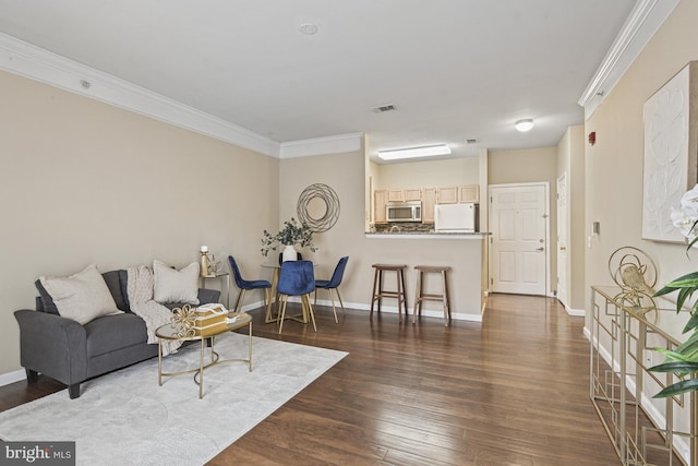 living area with visible vents, baseboards, dark wood-style floors, and ornamental molding