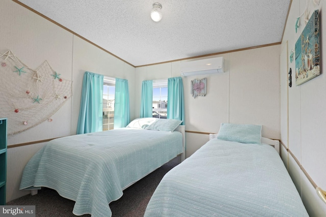 bedroom with lofted ceiling, a textured ceiling, ornamental molding, and a wall mounted AC