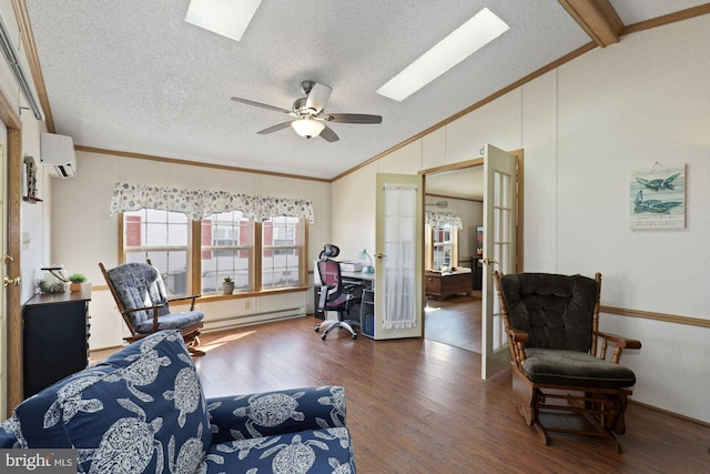 interior space with wood finished floors, vaulted ceiling with skylight, an AC wall unit, a baseboard heating unit, and crown molding