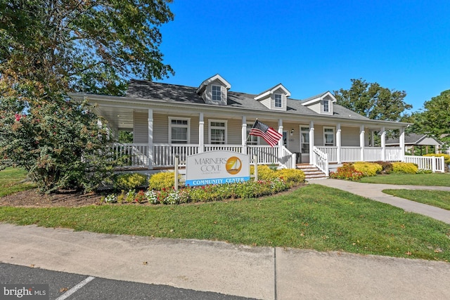 view of front of home featuring a front yard and covered porch