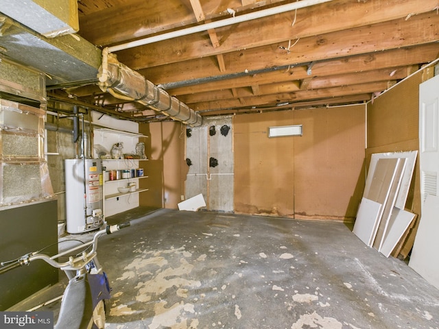 unfinished basement featuring water heater and visible vents