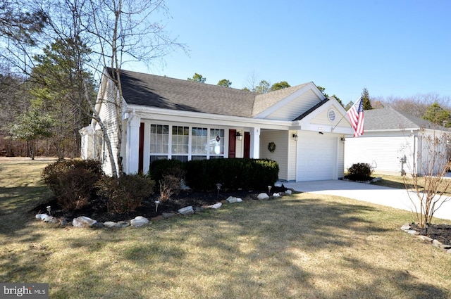 view of front facade with an attached garage, concrete driveway, a front lawn, and a shingled roof