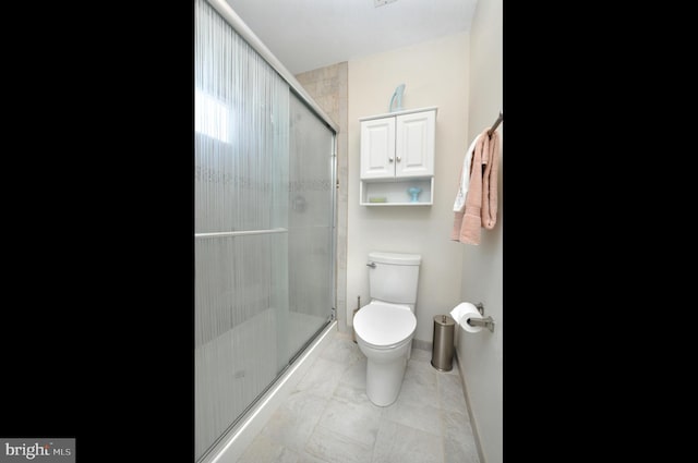 full bathroom featuring toilet and a stall shower