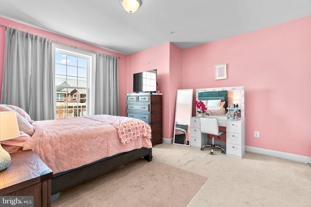 carpeted bedroom with baseboards