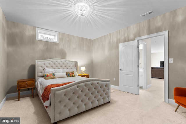 bedroom with visible vents, light colored carpet, and baseboards