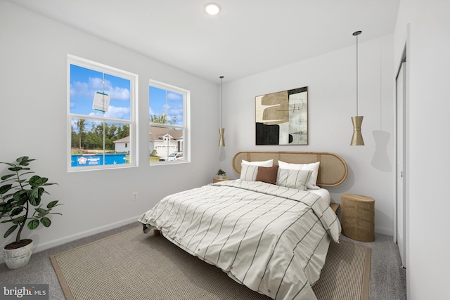 carpeted bedroom with baseboards