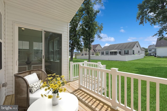 view of wooden balcony with a residential view and a wooden deck