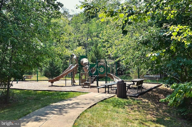 community play area featuring a lawn