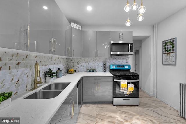 kitchen with a sink, gray cabinetry, appliances with stainless steel finishes, modern cabinets, and marble finish floor