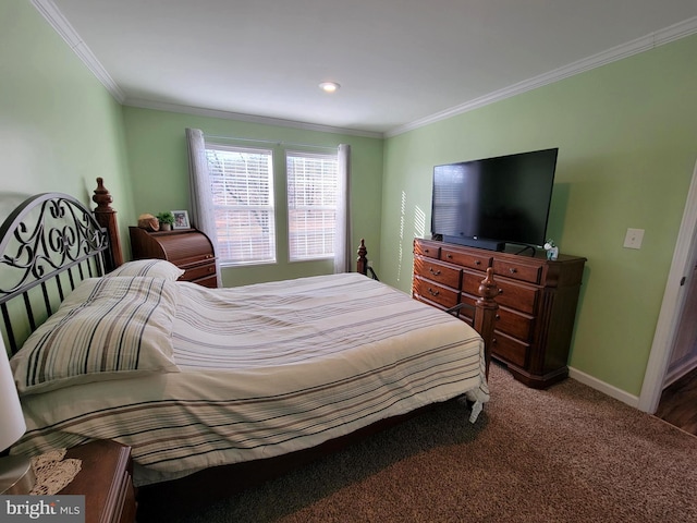 carpeted bedroom featuring crown molding and baseboards