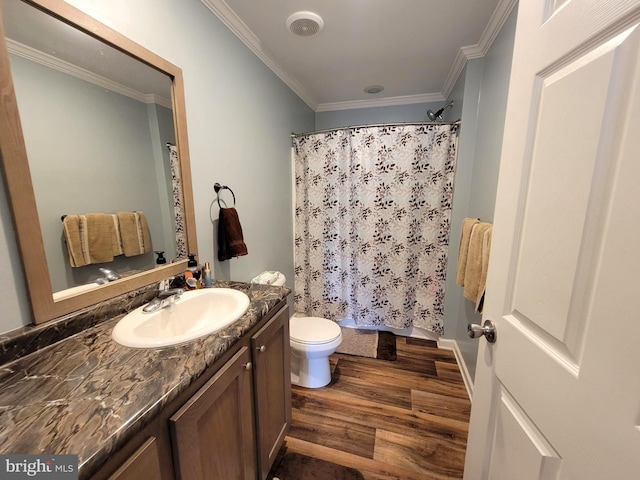 bathroom featuring vanity, a shower with curtain, wood finished floors, crown molding, and toilet