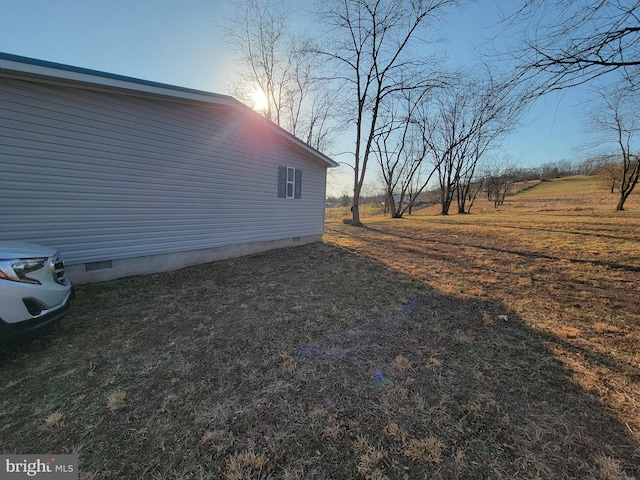 view of side of home featuring crawl space