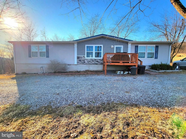 view of front of home featuring a wooden deck