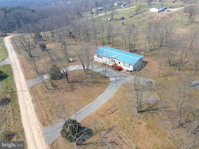 birds eye view of property featuring a rural view