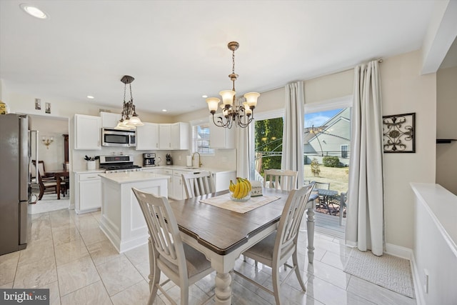 dining room featuring recessed lighting, baseboards, and a chandelier