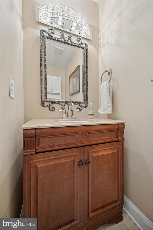 bathroom with baseboards and vanity