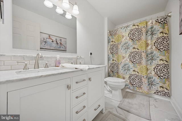 full bathroom featuring vanity, toilet, marble finish floor, and backsplash