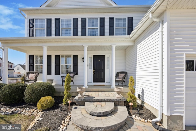 entrance to property featuring a porch