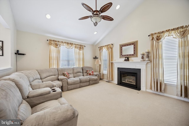 carpeted living room with a fireplace with flush hearth, high vaulted ceiling, a ceiling fan, recessed lighting, and baseboards