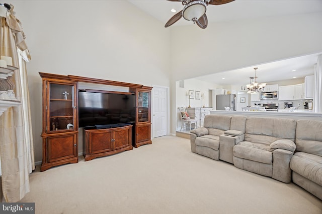 living room featuring visible vents, light carpet, recessed lighting, ceiling fan with notable chandelier, and a towering ceiling