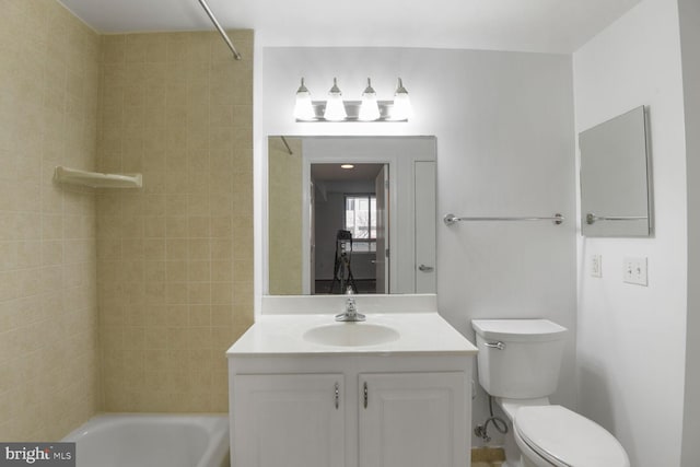 bathroom with shower / bathing tub combination, toilet, and vanity