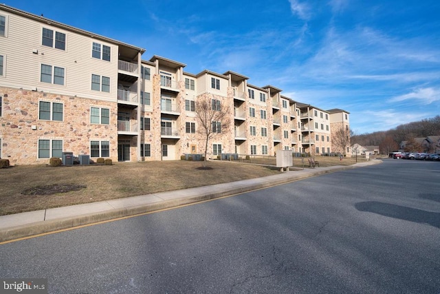 view of building exterior featuring central AC unit