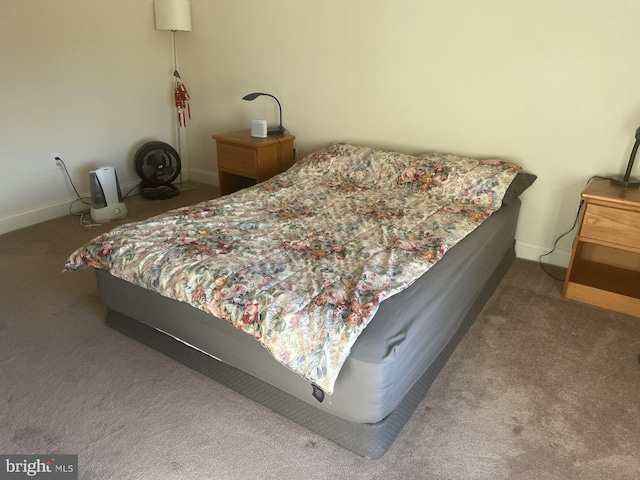 carpeted bedroom with baseboards