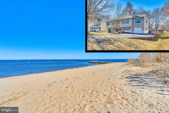 property view of water featuring a beach view