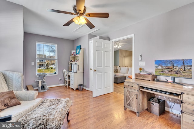 office with light wood-style flooring, baseboards, and ceiling fan