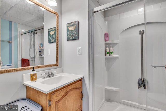 bathroom with a stall shower and vanity