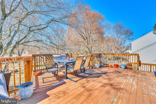 wooden deck with outdoor dining area