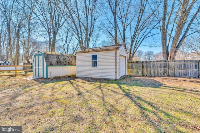 view of shed with a fenced backyard