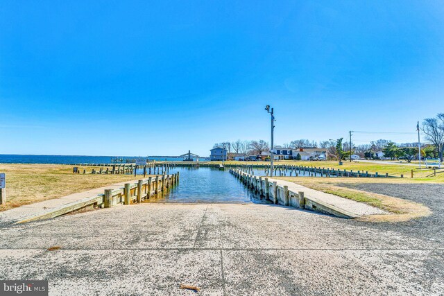 dock area featuring a water view