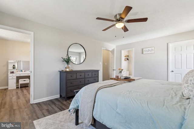 bedroom featuring a ceiling fan, baseboards, and wood finished floors