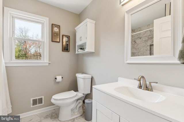 bathroom featuring visible vents, baseboards, toilet, marble finish floor, and vanity